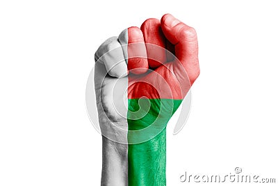 Man hand fist of MADAGASCAR flag painted. Close-up. Stock Photo