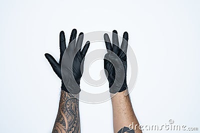 A man hand and gestures in Black rubber glove shows eight sign isolated on white background Stock Photo