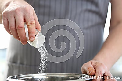 Man hand hold saltcellar salt soup cloceup Stock Photo