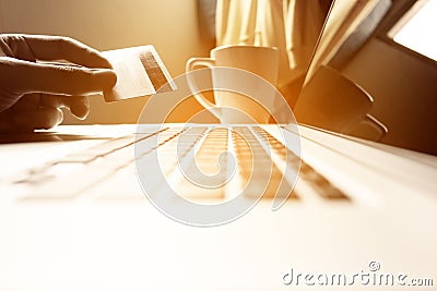 Man hand holding credit card with online shopping or internet ba Stock Photo