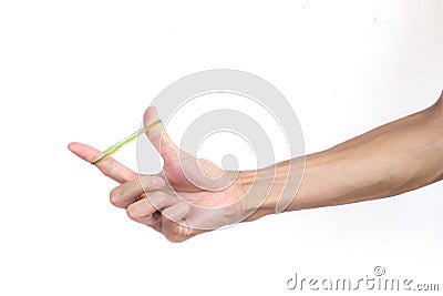 A man hand holding elastic rubber band on white background. Stock Photo