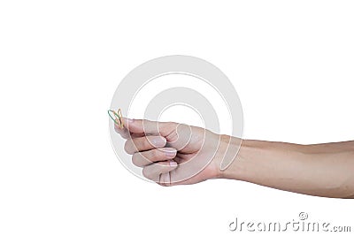 A man hand holding elastic rubber band on white background. Rubber band used to tie the goods. Or used to close the plastic bag. Stock Photo