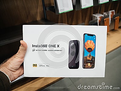 Man hand holding new Insta 360 One x action camera box Editorial Stock Photo