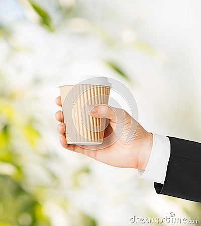 Man hand holding take away coffee Stock Photo