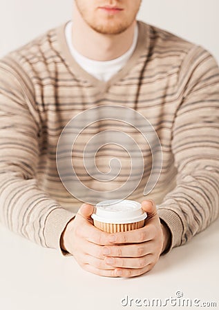Man hand holding take away coffee cup Stock Photo