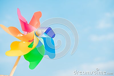 man hand holding turbines windmills on sky object for freedom, kid, windmills air childhood child motion lifestyle park play and Stock Photo