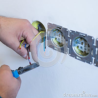 hand install electrical wire Stock Photo