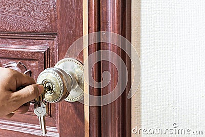 Man hand Locking Door Stock Photo