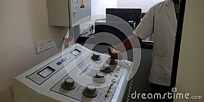 Man hand operating machine at laboratory Editorial Stock Photo