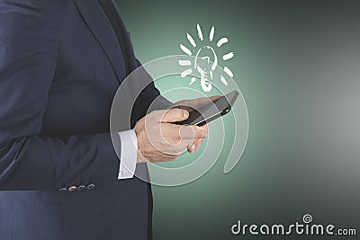 Man hand phone with light bulb in screen Stock Photo