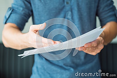 Man hand point fact document business papers proof Stock Photo