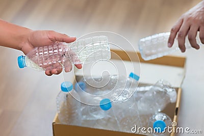 Man hand putting plastic reuse for recycling concept environmen Stock Photo