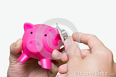 Man hand stethoscope pink piggy bank Isolated on white background. Health care cost. Financial state condition self assessment co Stock Photo