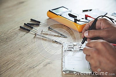 Man hand tester and phone Stock Photo