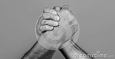 Man hand. Two men arm wrestling. Arms wrestling. Closep up. Friendly handshake, friends greeting, teamwork, friendship Stock Photo