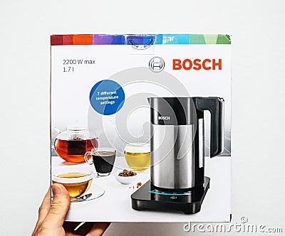 Man hand unboxing unpacking Bosch TWK7203 kettle Editorial Stock Photo