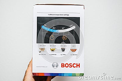 Man hand unboxing unpacking Bosch TWK7203 kettle Editorial Stock Photo