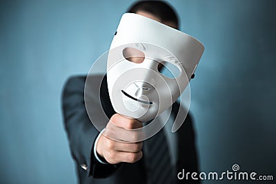 Man hand white mask Stock Photo