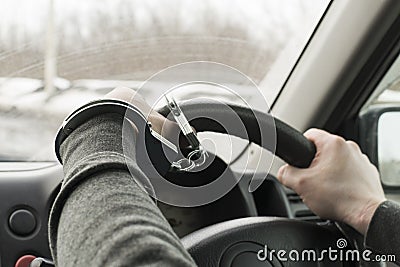 The man in handcuffs, riding in the car. Stock Photo
