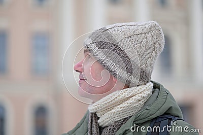 Man in handmade knitted winter beanie hats form natural lamb wool with cable pattern Stock Photo