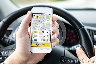 Man hands in car holding phone with app call taxi Stock Photo