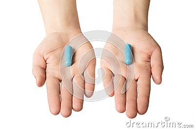 Man hands giving two big blue pills. Make your choice. Calm nerves consept Stock Photo