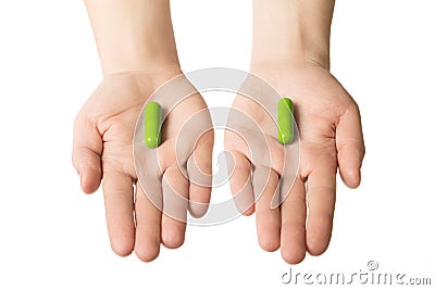 Man hands giving two big blue pills. Make your choice of healthcare. Herbal consept. Stock Photo