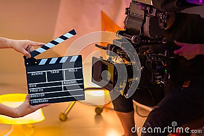 Man hands holding movie clapper. Film director concept. Behind the scenes of movie shooting or video production and film crew team Stock Photo