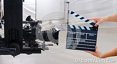 Man hands holding movie clapper. Film director concept. Behind the scenes of movie shooting or video production and film crew team Stock Photo