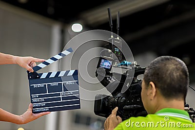 Man hands holding movie clapper.Film director concept.camera show viewfinder image catch motion in interview or broadcast wedding Editorial Stock Photo