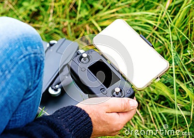 Man hands holding remote control for launching drone in day Stock Photo