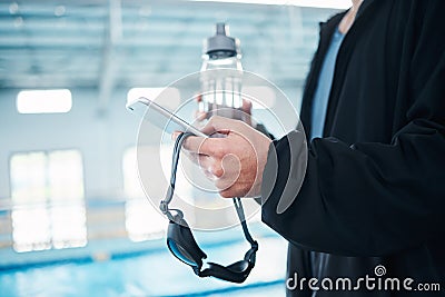 Man hands, phone texting and swimming pool with goggles, water bottle or communication on social media. Aquatic sports Stock Photo