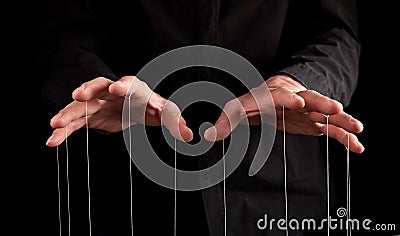 Man hands with strings at fingers. Manipulator controlling, exploiting person, showing power in relationship, at work Stock Photo