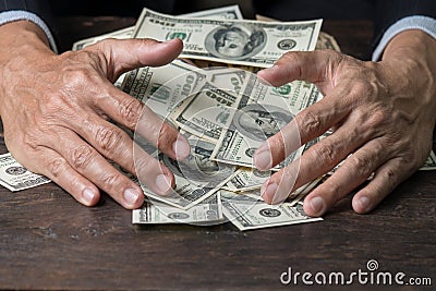 Man hands sweeping money,business concept. Stock Photo