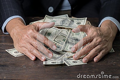 Man hands sweeping money,business concept. Stock Photo