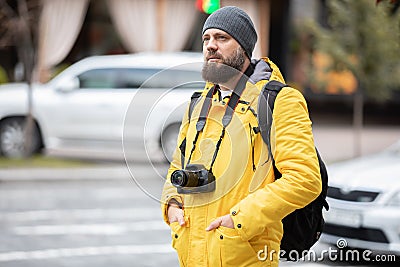 Man hanging film camera on neck at walking street and travel concepts Stock Photo