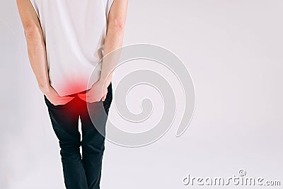 Man has diarrhea holding his and isolated on white background Stock Photo