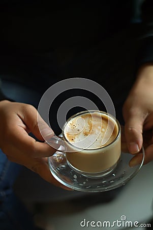 The man has a nice latte in his hand Stock Photo