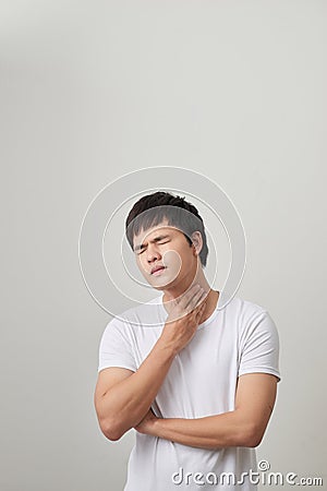 Man has a terrible pain in throat because of flu. He lost his voice and can not speak Stock Photo