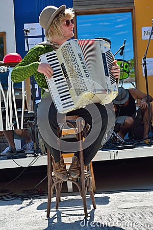 Man with hat playing the accordeon Editorial Stock Photo