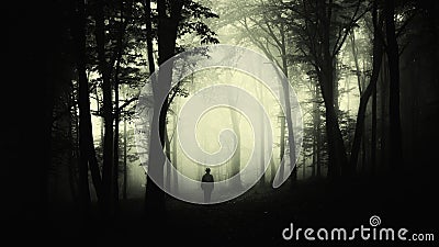 Man in creepy forest with fog on Halloween Stock Photo