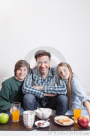 Man having a breakfast with your two childrens Stock Photo