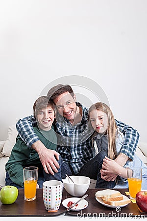 Man having a breakfast with your two childrens Stock Photo
