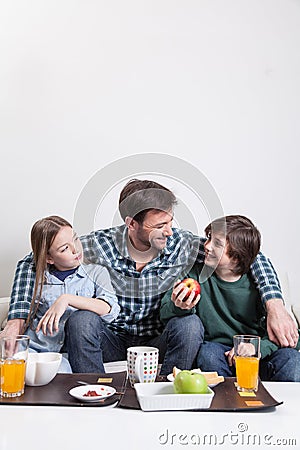 Man having a breakfast with your two childrens Stock Photo