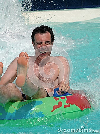 Man having fun at waterpark Stock Photo