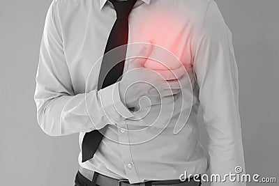 Man having heart-attack / chest pain in background Stock Photo