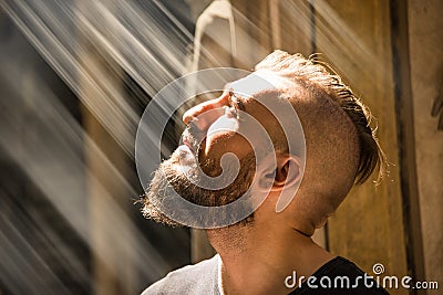 A man is having an illumination moment with god. Stock Photo