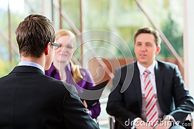 Man having an interview with manager and partner employment job Stock Photo