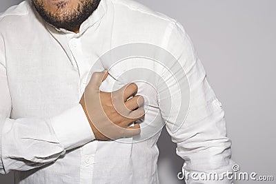 Man having a pain in the heart on white. Stock Photo