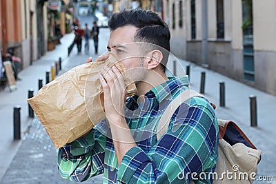 Man having a panic attack in the crowd Stock Photo